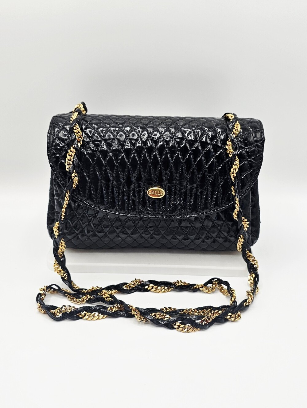 Ballys' Black Quilted Flap Shoulder Bag with Gold Chain Strap